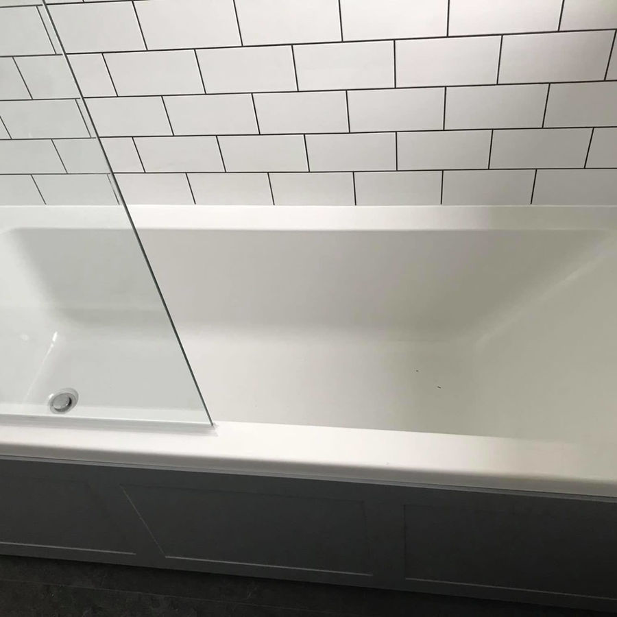 New bath fitted in a completed bathroom