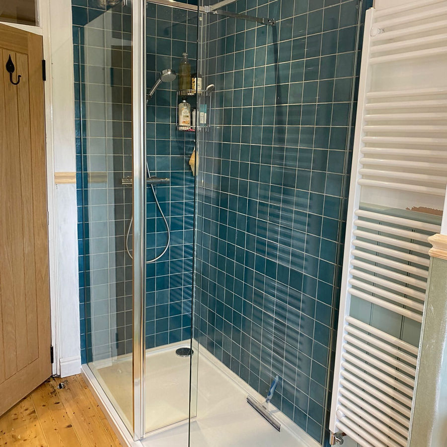 New shower with blue tiled wall